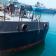 In this photo provided Monday, May 11, 2020, by the Iranian Army, the Konarak support vessel which was struck during a training exercise in the Gulf of Oman, is docked in an unidentified naval base in Iran.mage caption